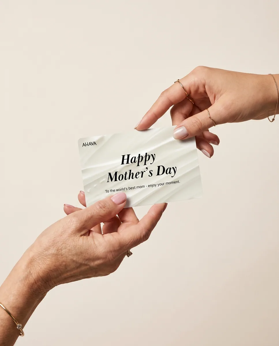 Two hands passing an AHAVA Mother's Day gift card